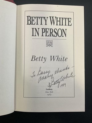 Lot 73 - A pair of hardback books signed by female...