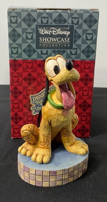 Lot 535 - A group of 4 Walt Disney ceramic figures...