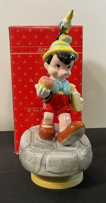 Lot 535 - A group of 4 Walt Disney ceramic figures...