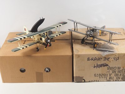 Lot 584 - BRAVO DELTA pair of Fairey hand-carved wooden...