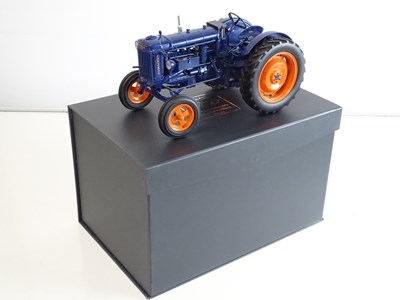Lot 13 - A group of diecast tractor models to include a...